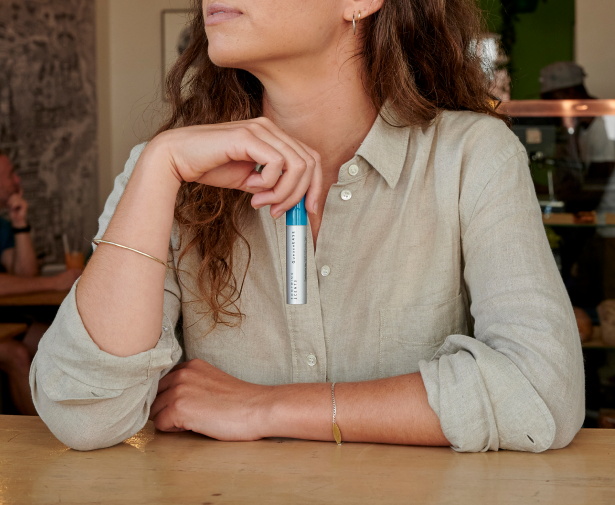 woman holding soothing scents product