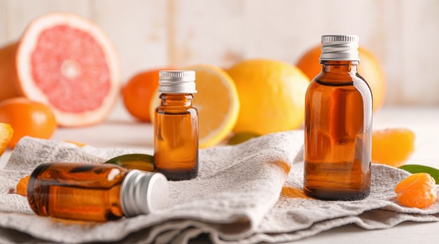 essential oils with citrus in background